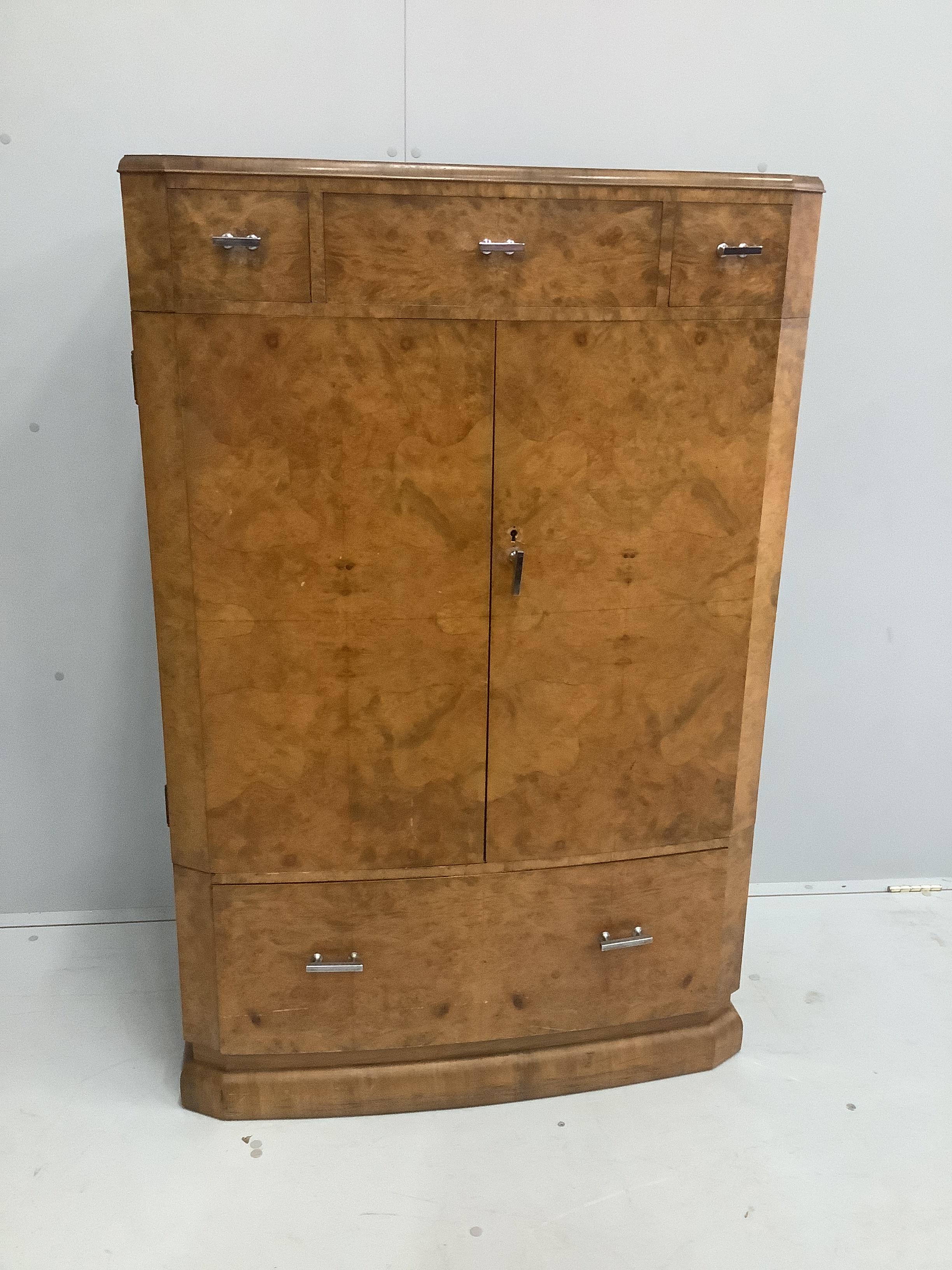 An Art Deco style burr walnut press cupboard, width 85cm, depth 48cm, height 129cm